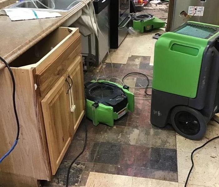 kitchen counter and kitchen cabinets with air movers for drying